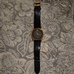 Movado Elegant Black and Gold Watch